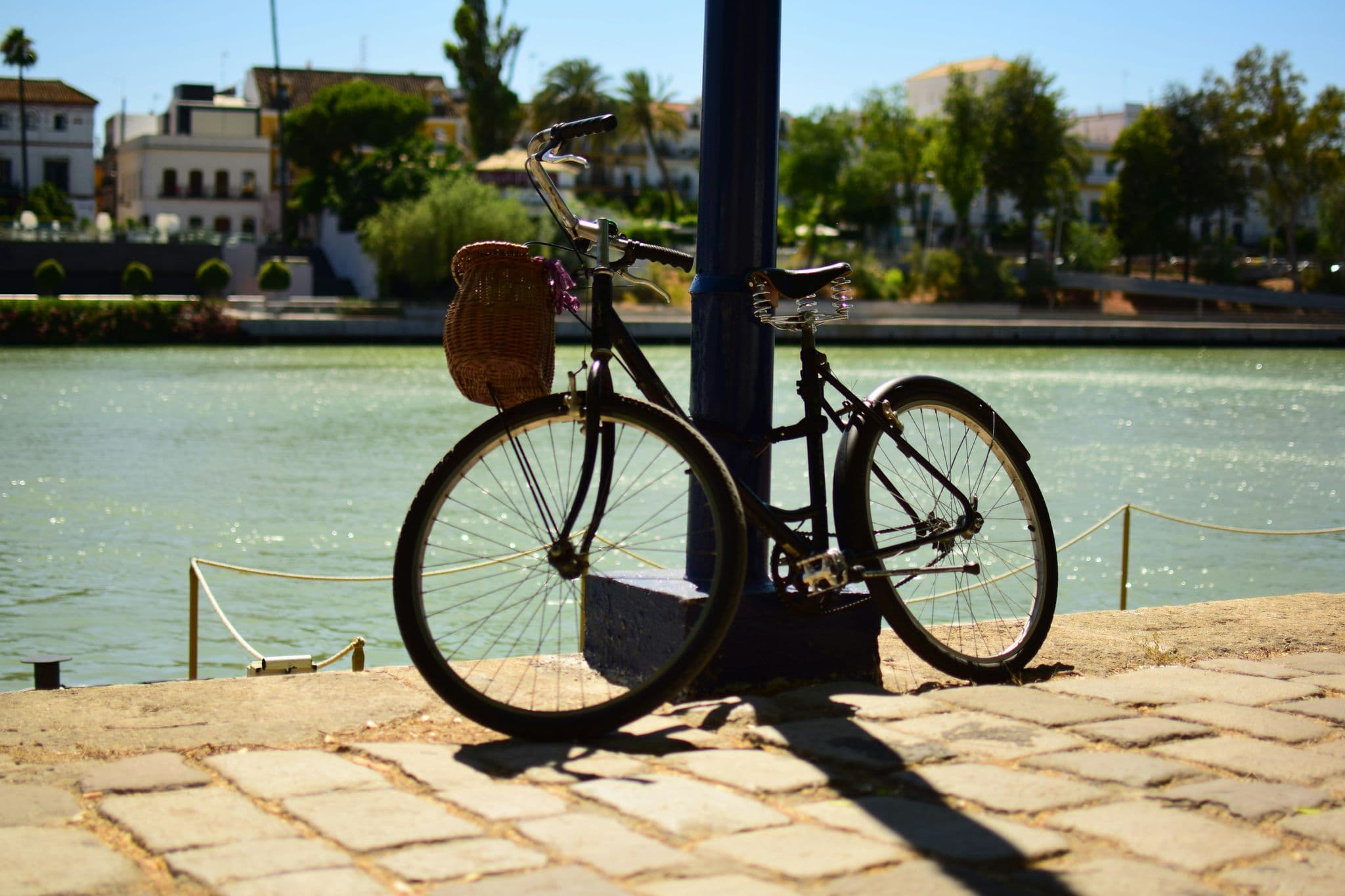 black bike beside body of water