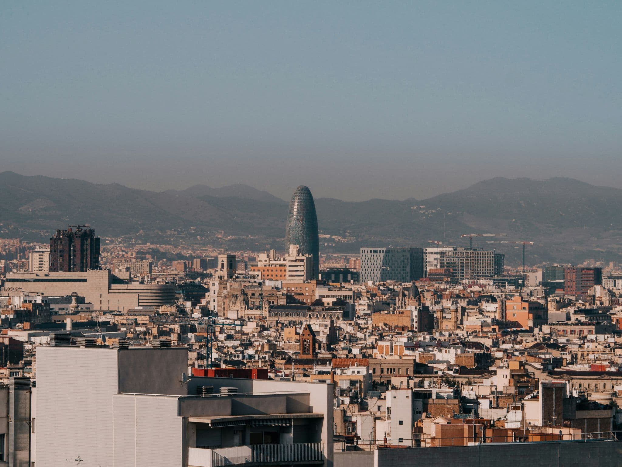 A view of a city with mountains in the background